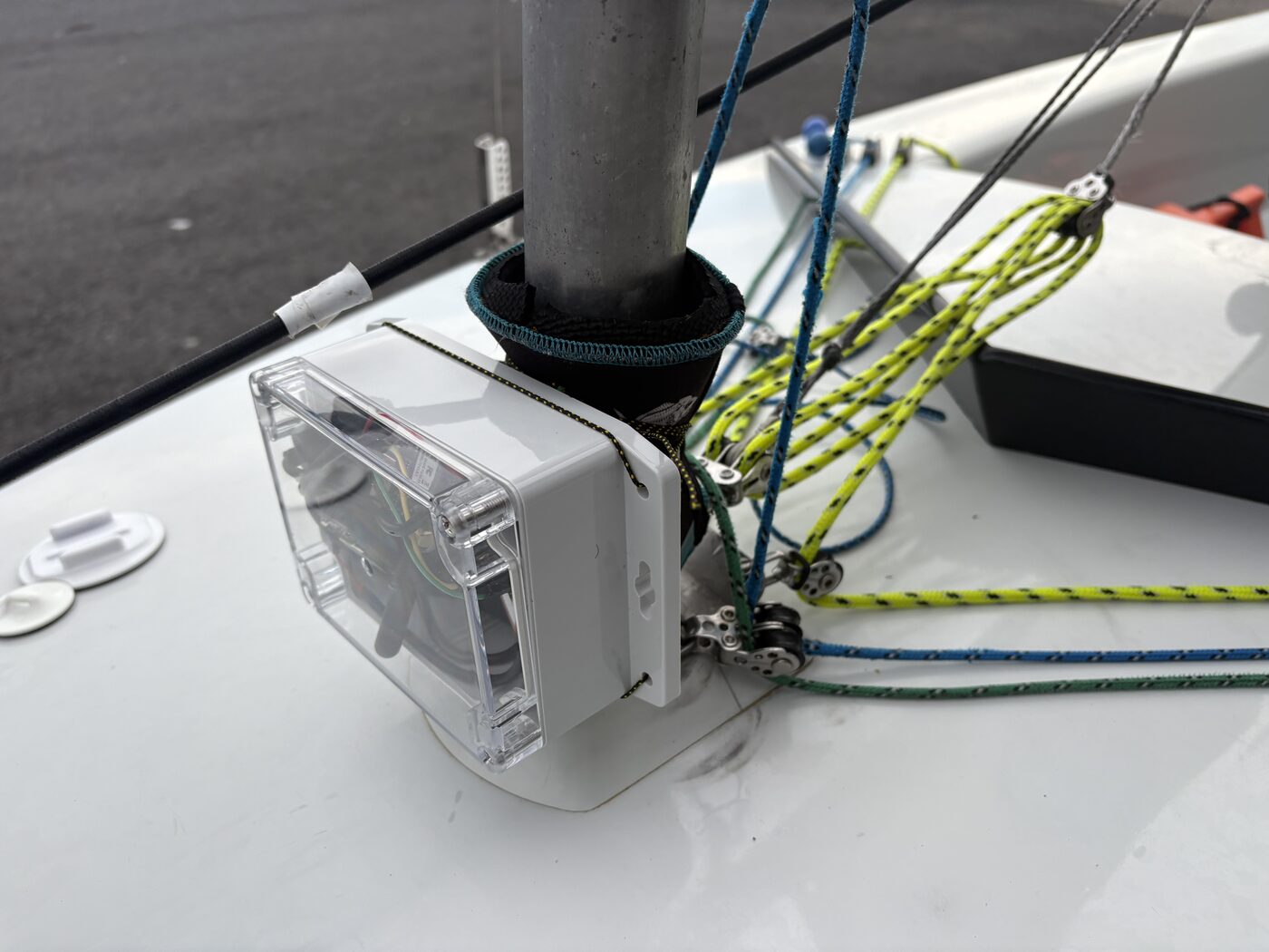 The tracker mounted at the base of the mast on the boat